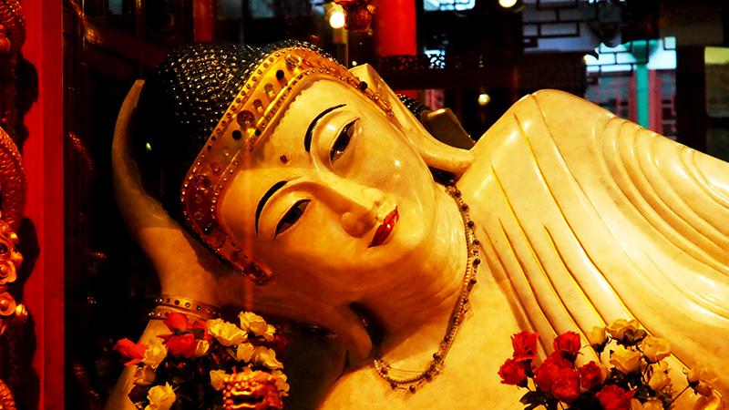 A close shot of a white jade Buddha