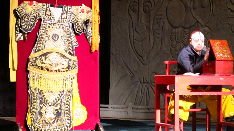 The actor is preparing for Peking Opera Show