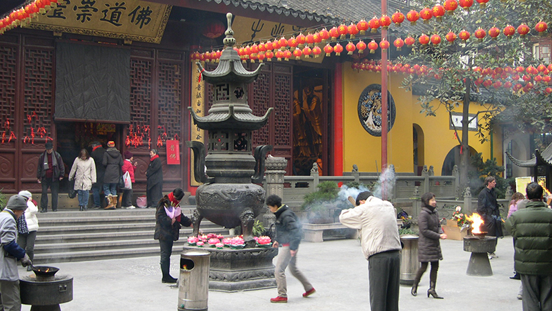 People pray for good luck in Jade Buddha Temple
