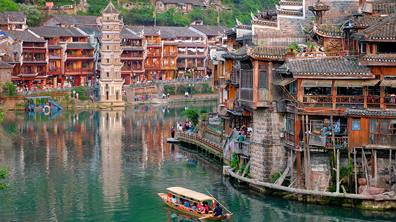 Take a boat on the river in Fenghuang Ancient Town