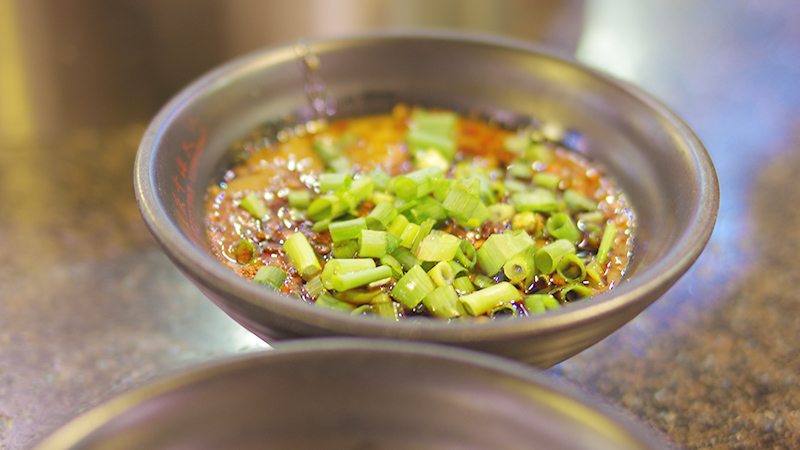 A bowl of dipping sauce for Chongqing hot pot