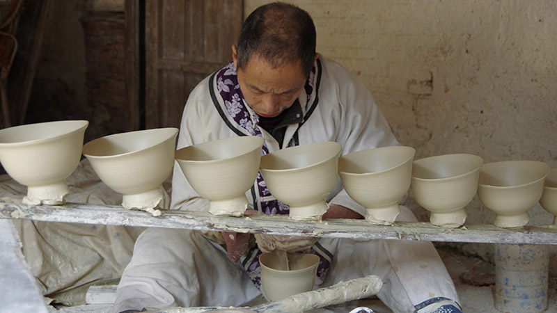 A worker is working on ceramics in Jingdezhen