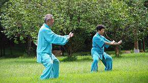 People play Tai Chi in a park in Guilin
