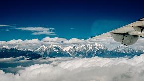 Admire Mount Everest on the airplane